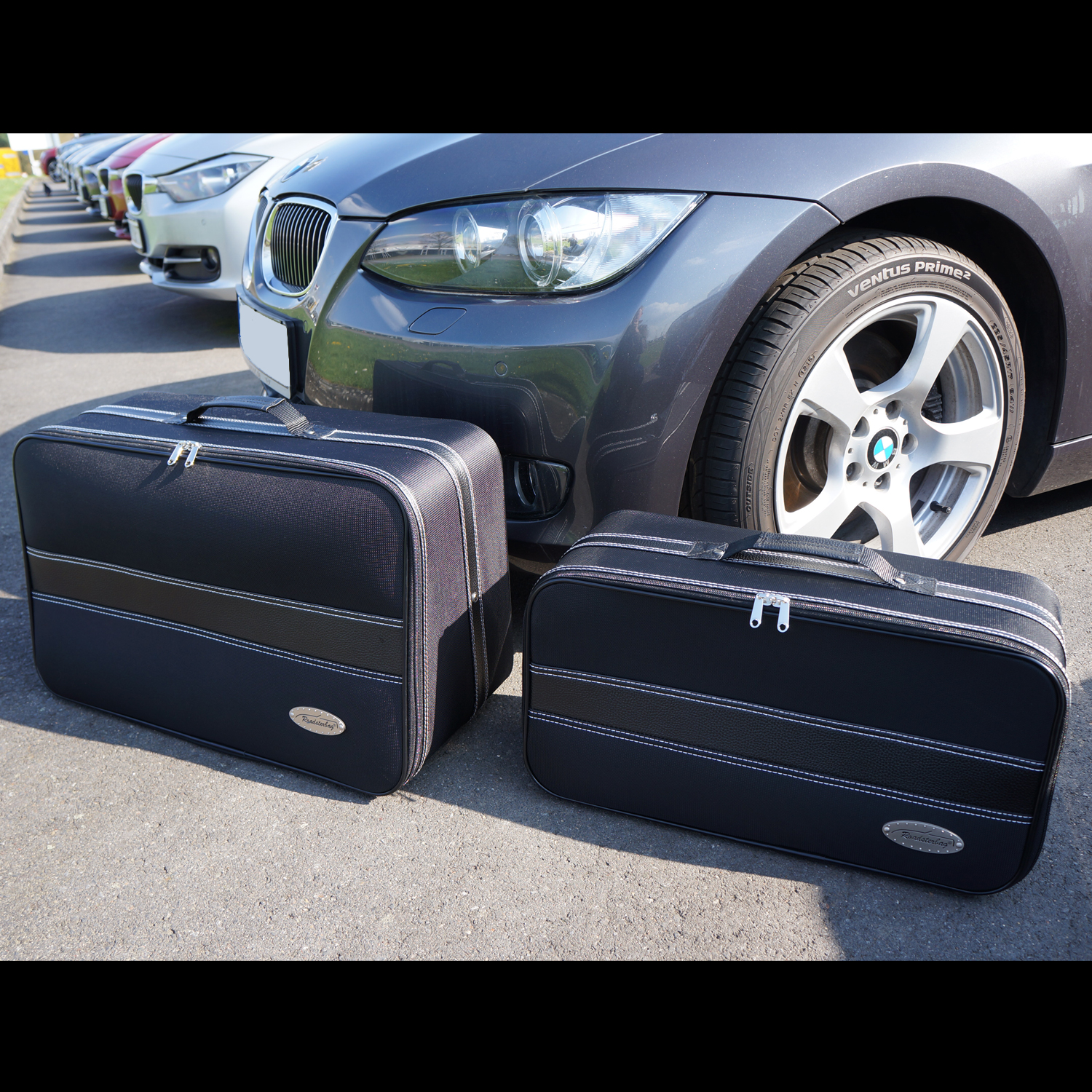 bmw 3-serie E93 bagageväskor framför bil
